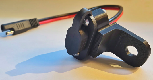 Charging port lower mount bracket for newer touring models